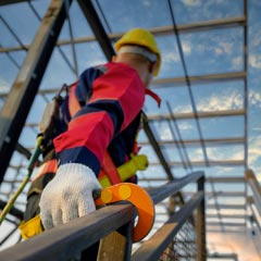 Worker with harness and safety equipment