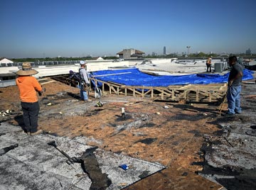 Workers repairing foundation